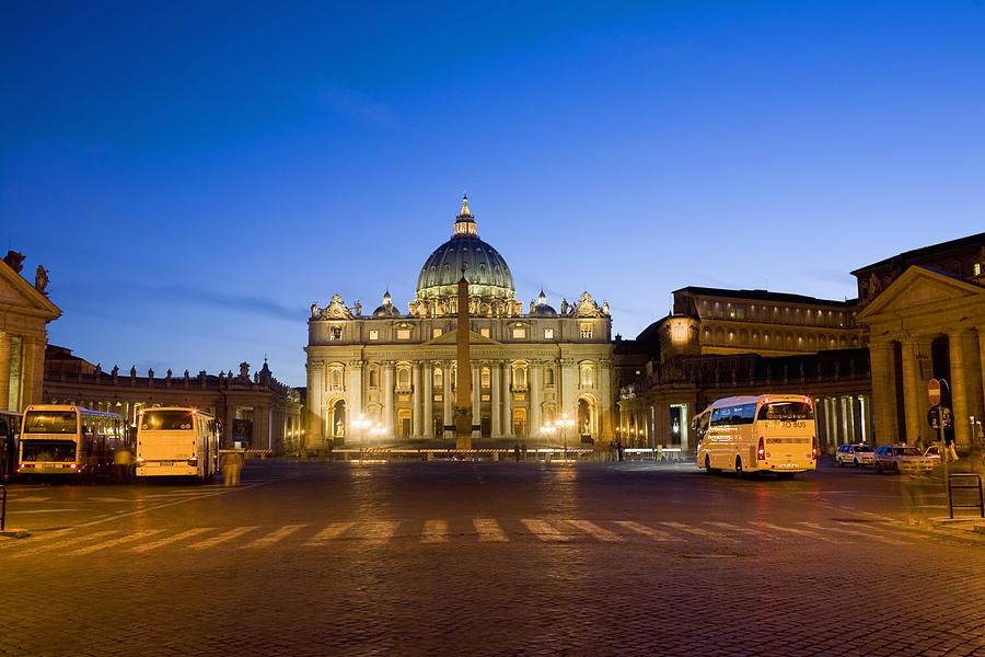 Basilica lit up at dusk, St. Peters Basilica, St. Peters Square, Vatican City Photograph by Glowimages