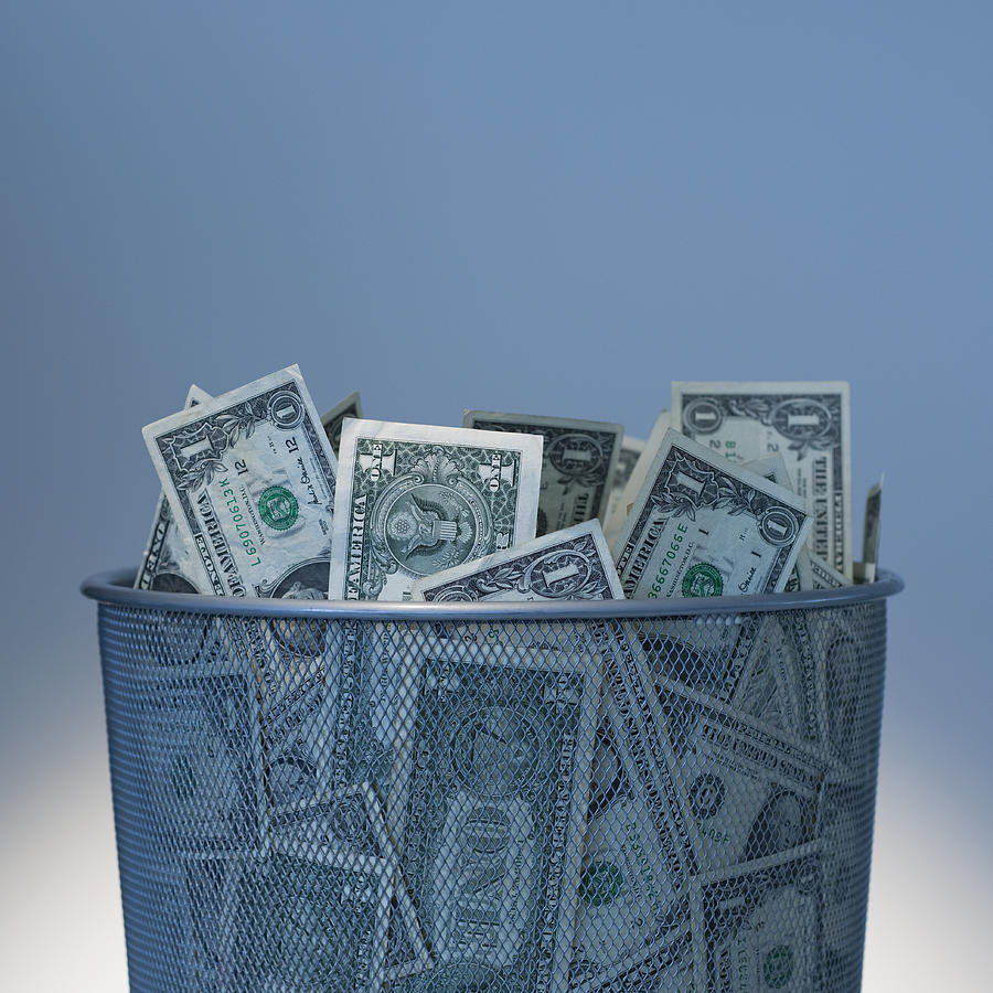 Basket of money Photograph by Tetra Images