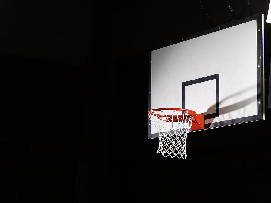 Basketball board against a black background Photograph by Compassionate Eye Foundation/Steve Coleman/OJO Images Ltd