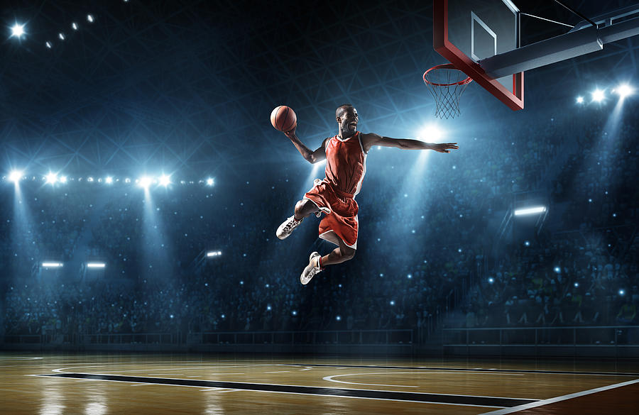 Basketball player makes slam dunk Photograph by Dmytro Aksonov
