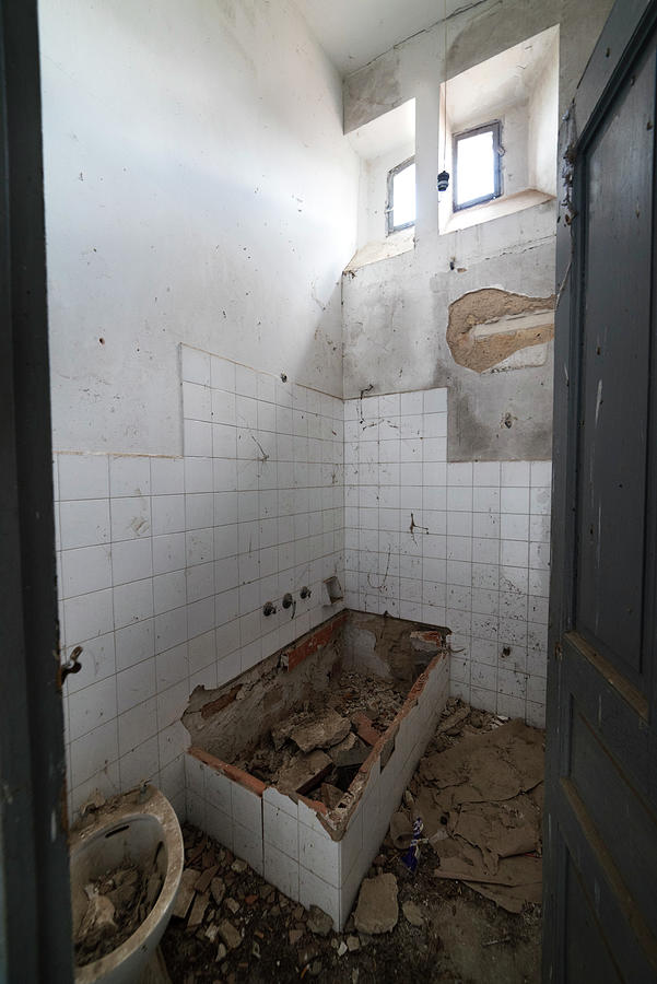 Bathroom in an abandoned railway station. Photograph by RicardMN Photography