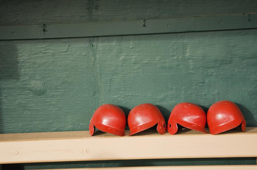 Batting helmets on a bench in a dugout Photograph by Masakazu Watanabe / Aflo