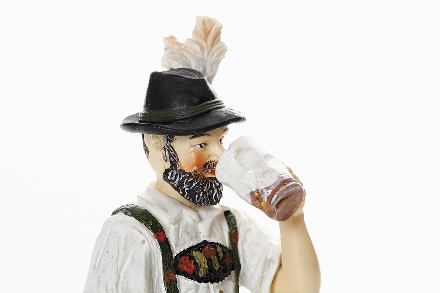 Bavarian figurine drinking beer from beer stein Photograph by Tuned_In