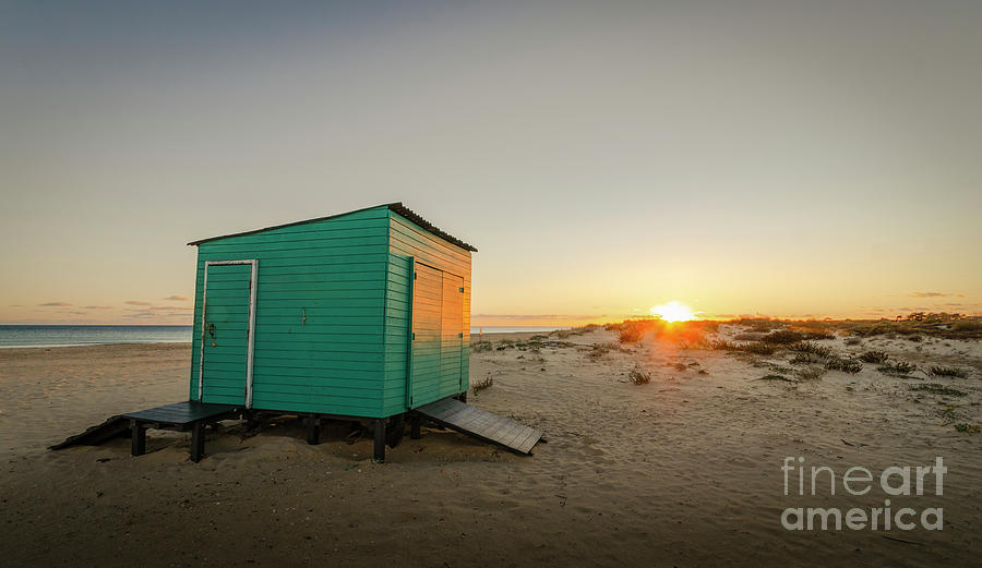 Beach at sunset, green cabin, hut Photograph by Perry Van Munster