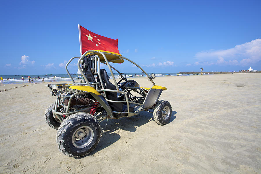 Beach bike with a chinese flag on it Photograph by Huchen Lu