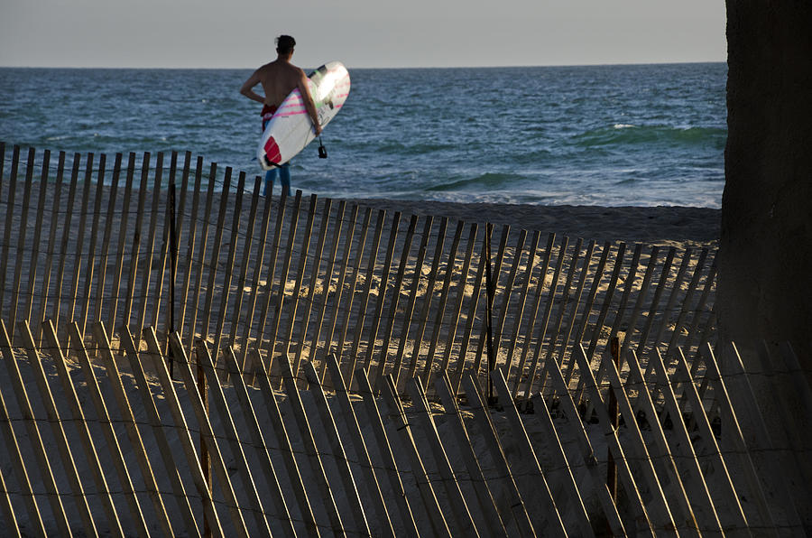 Beach Fence with surfer Photograph by Mitch Diamond