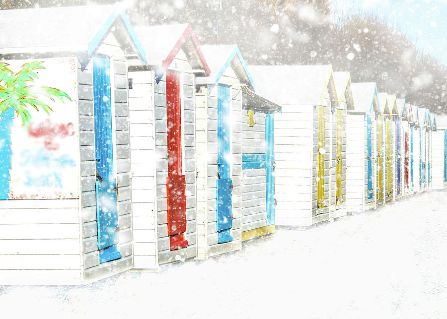Beach Huts during a snow shower Photograph by Sue Leonard