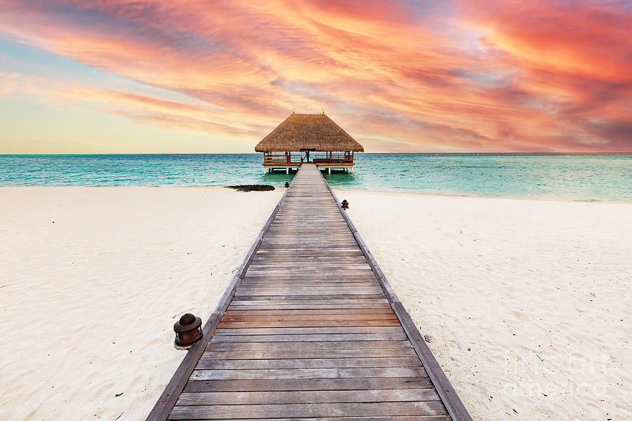 Beach in Maldives at sunset, wooden jetty Photograph by Michal Bednarek