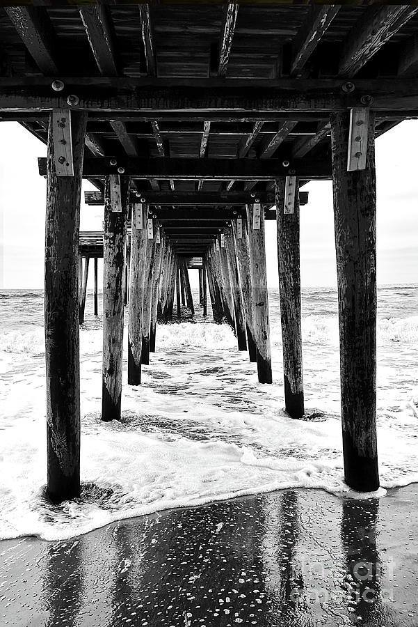 Beach Surf And Reflections Under A Pier-black And White Photograph