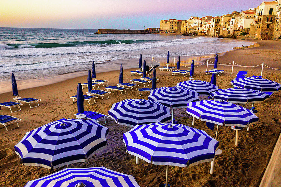 Beach umbrellas in Cefalu Sicily Italy Photograph by Toni and Rene Maggio