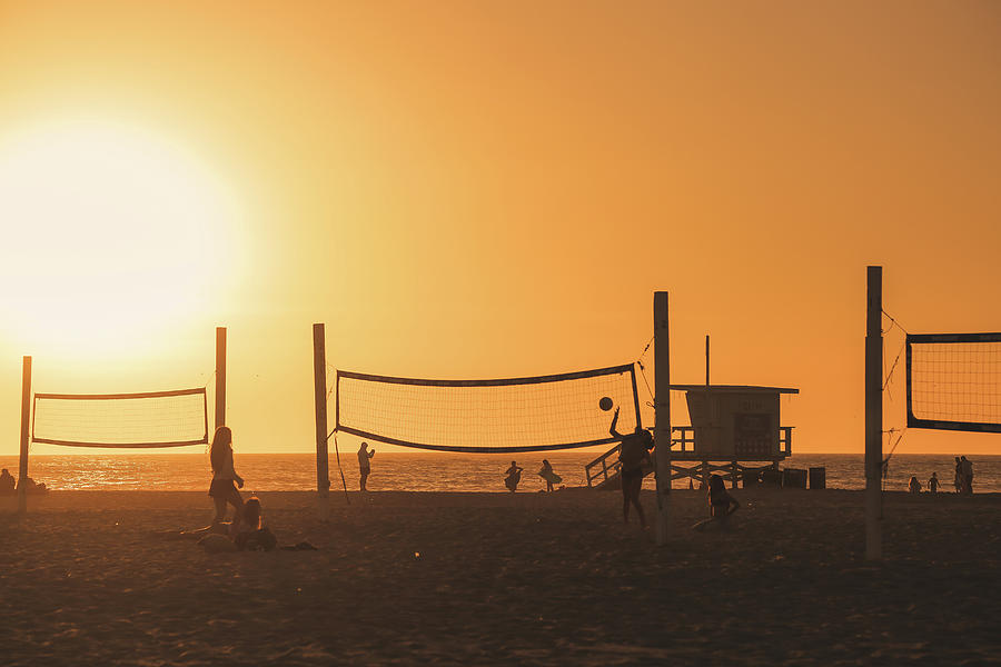 Beach Volley At Sunset Photograph by Alberto Zanoni