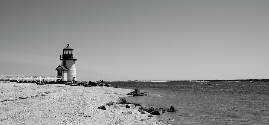 Beach with a lighthouse in the background, Brant Point Lighthouse, Nantucket, Massachusetts, USA Photograph by Panoramic Images