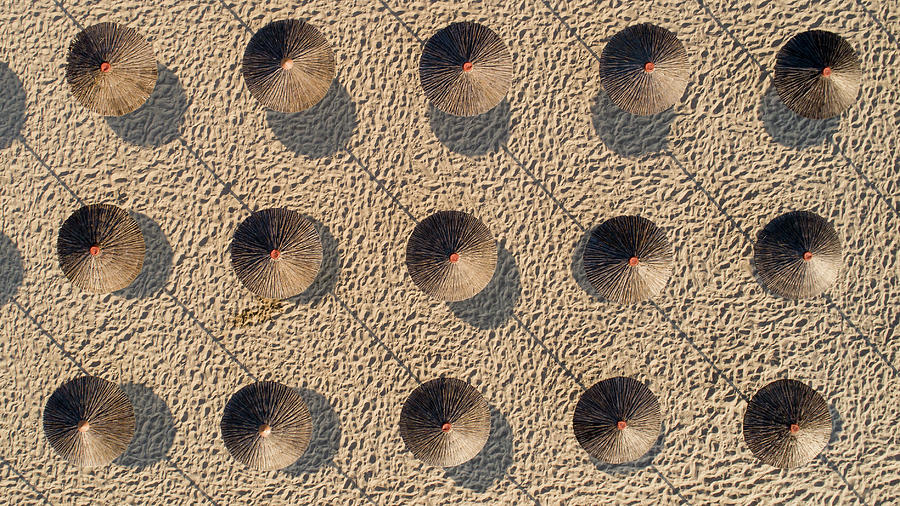 Beach With Straw Umbrellas. Photograph