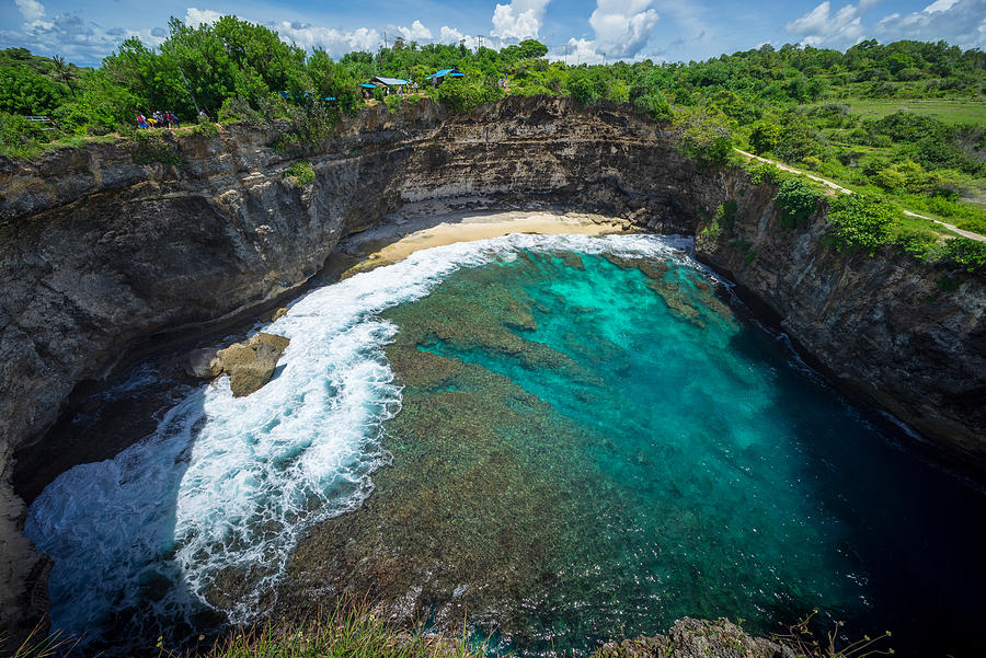 Beautiful arched broken beach with big waves and crystal clear water in Nusa Penida in Bali, Indonesia. Photograph by Shaifulzamri