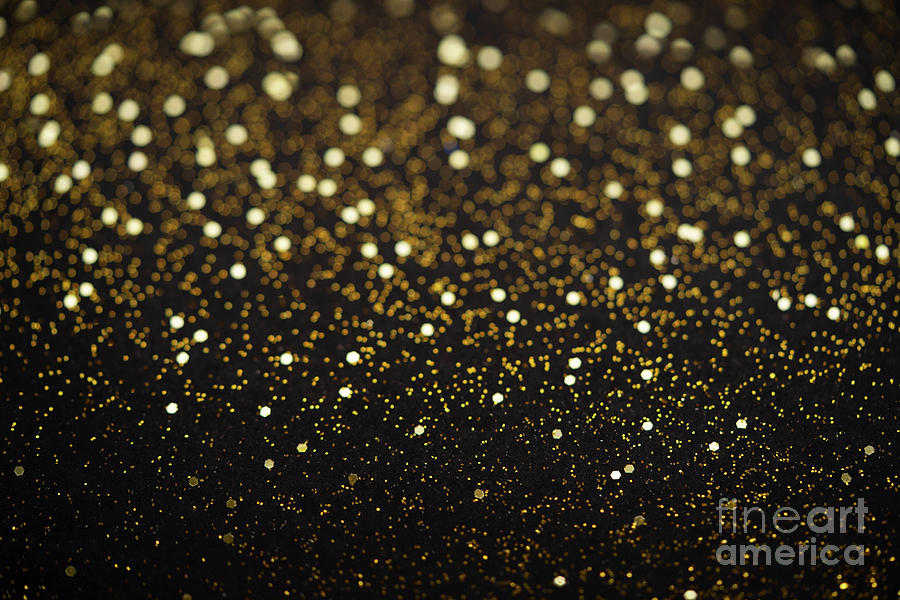 Beautiful Christmas Light Background. Abstract Glitter Bokeh And Scattered Sparkles In Gold, On Black Photograph