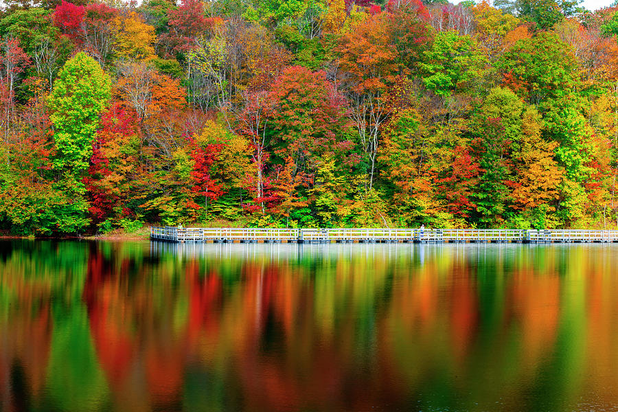 Beautiful colors on the lake in the Fall at Summit Lake Photograph by Dan Friend