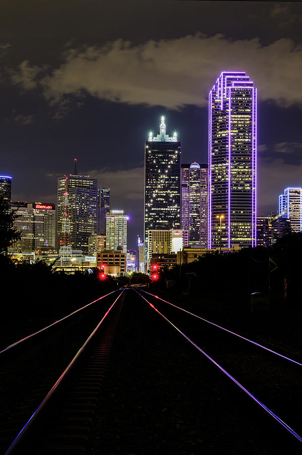 Beautiful Dallas TX skyline at night. by David Ilzhoefer