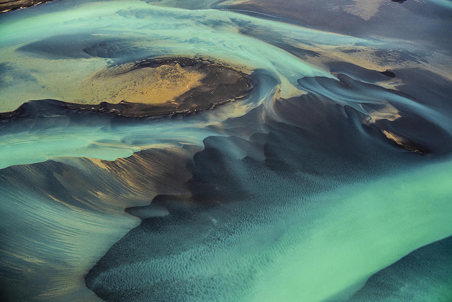 Beautiful emerald-colored glacial rivers of Iceland, taken from a helicopter Photograph by Extreme-photographer