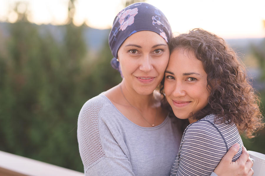 Beautiful Ethnic Woman with Cancer Hugs Her Sister Photograph by FatCamera