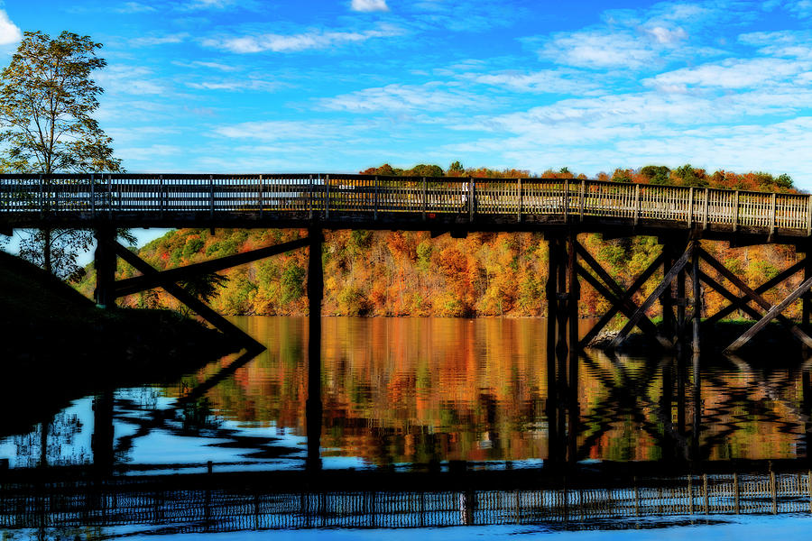 Beautiful Fall day on lake with rail trail  Photograph by Dan Friend