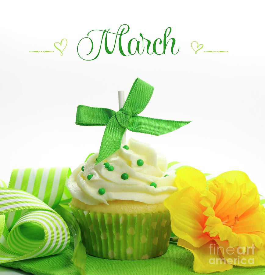 Beautiful green and yellow Spring theme cupcake with doffodils Photograph by Milleflore Images