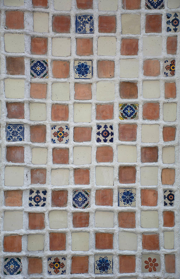 Beautiful handmade tiles forming a mosaic on a wal Photograph by Martonaphoto