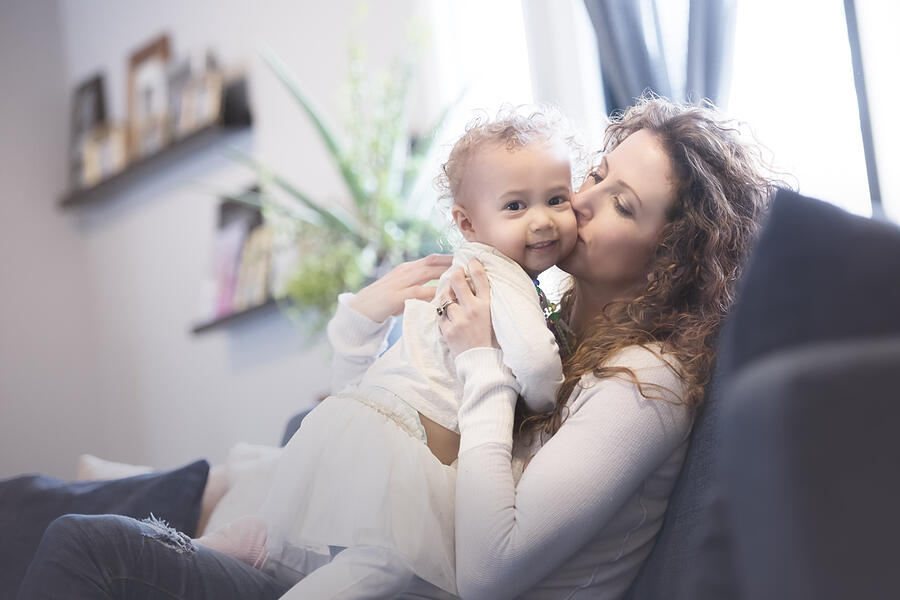 Beautiful Mixed Race Mother and Daughter Play at Home on the Couch Photograph by Jill Lehmann Photography