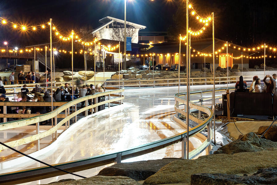 Abstract Photograph - Beautiful Outdoor Ice Rink At Night With Lights by Alex Grichenko
