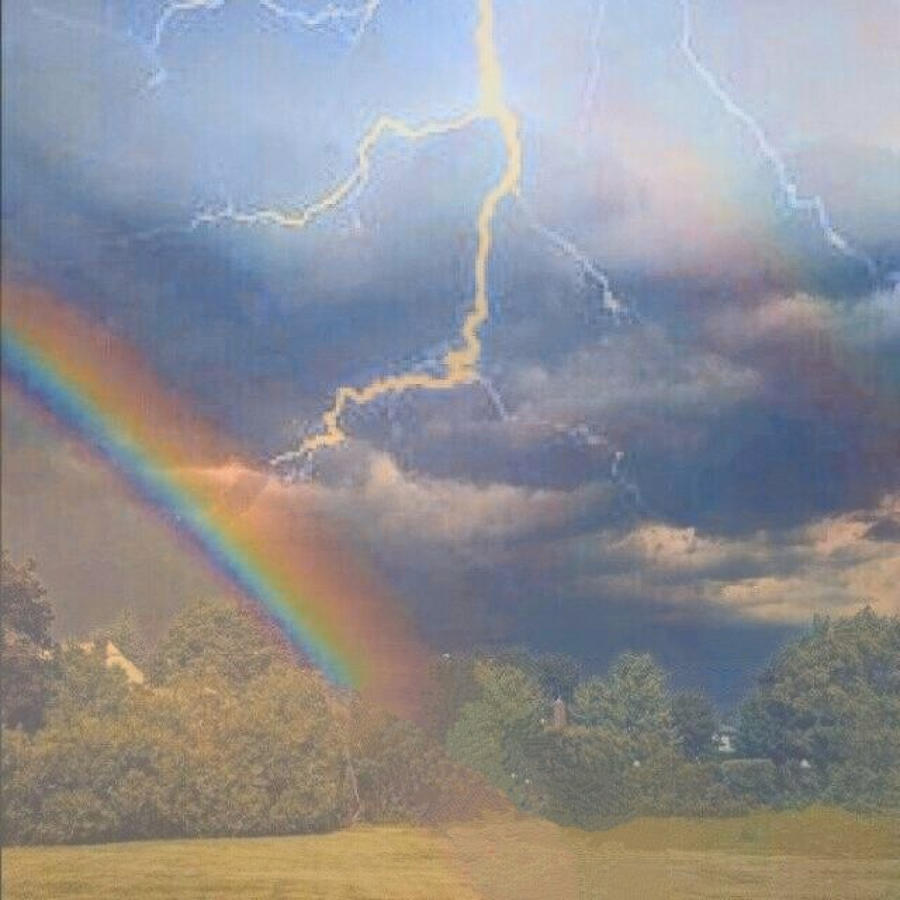  Sky With Rainbow and Lightning  Photograph by Freddy Alsante