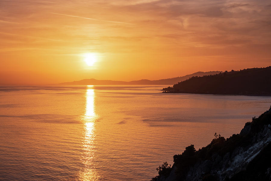 Beautiful Sunset with the Sun Shining Over the Sea at Halkidiki in Greece Photograph by Alexios Ntounas