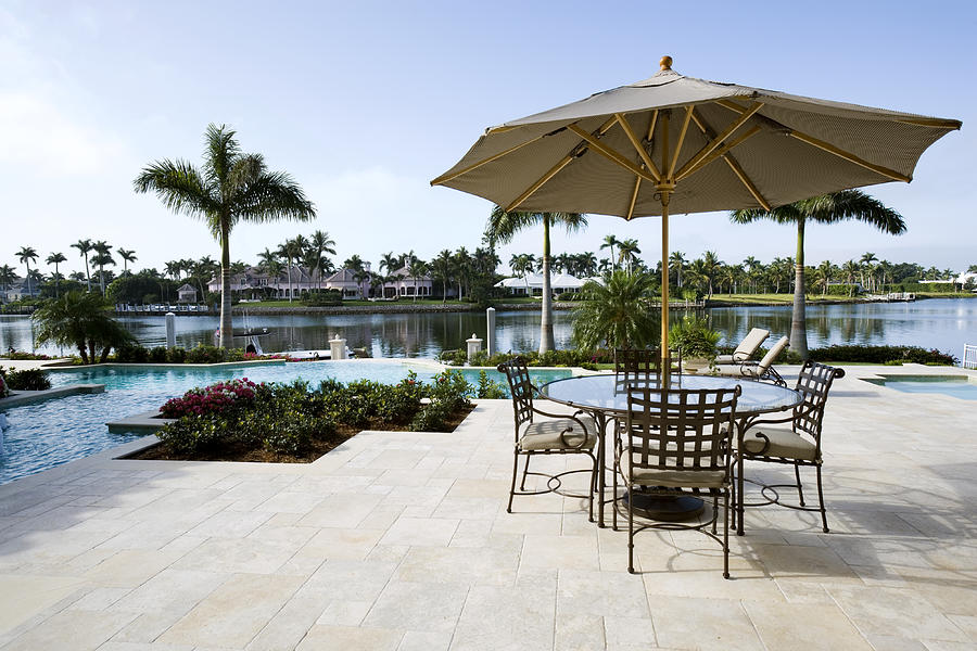 Beautiful Swimming Pool and Patio Overlooking Waterway Photograph by TerryJ
