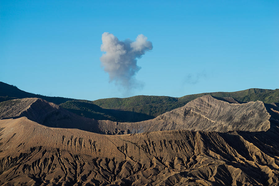 Beautiful view landscape of active volcano crater with smoke at Mt. Bromo, East Java, Indonesia. Photograph by Shaifulzamri