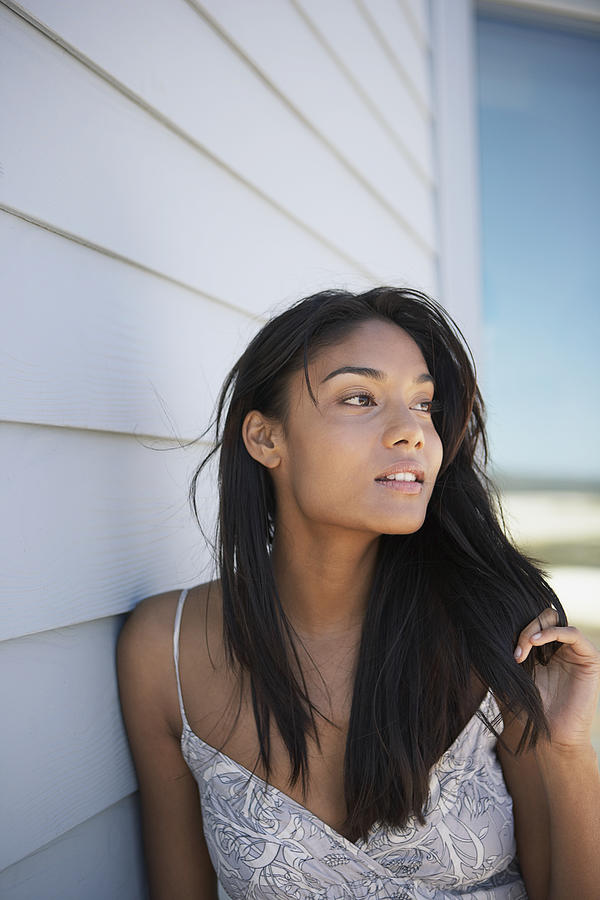 Beautiful woman by side of house Photograph by Felix Wirth