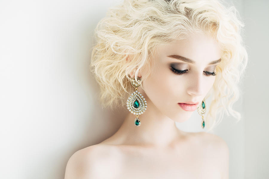 Beautiful woman with beautiful earings and hairstyle Photograph by CoffeeAndMilk