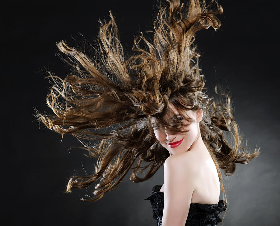 Beautiful Woman With Luxurious Hair Photograph by Stock_colors