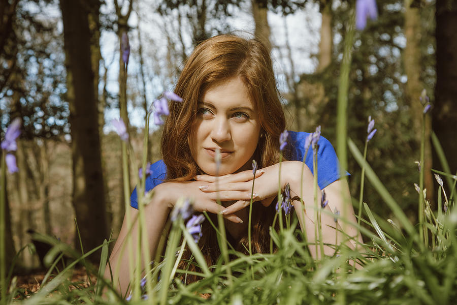 Beautiful young woman amongst the bluebells Photograph by Theasis