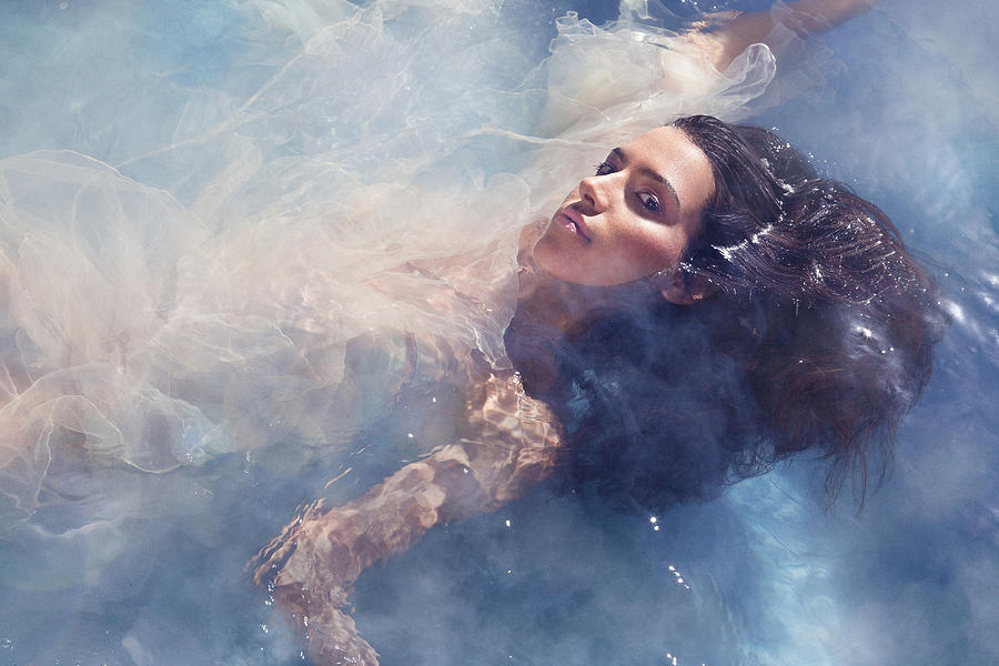 Beauty image of woman in water with smoke Photograph by Rebecca Handler