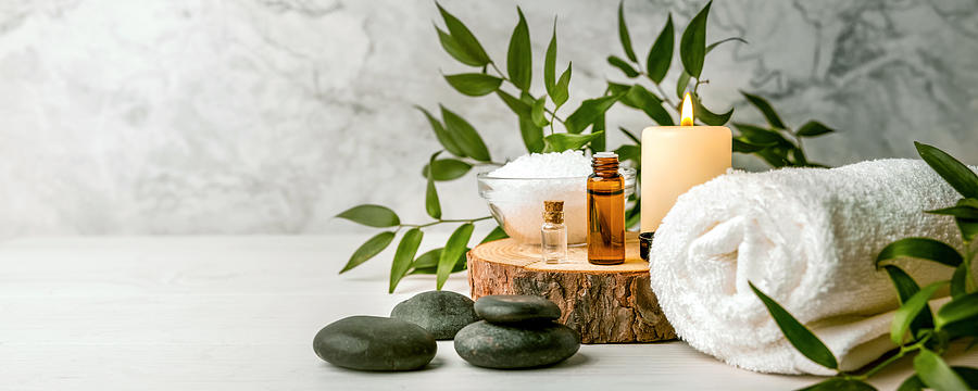 Beauty Treatment Items For Spa Procedures On White Wooden Table. Massage Stones, Essential Oils And Sea Salt. Copy Space Photograph by Ronstik