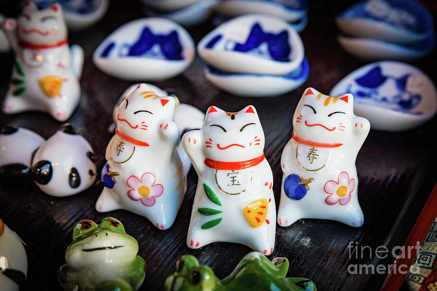 Beckoning cat figurines Photograph by Lyl Dil Creations