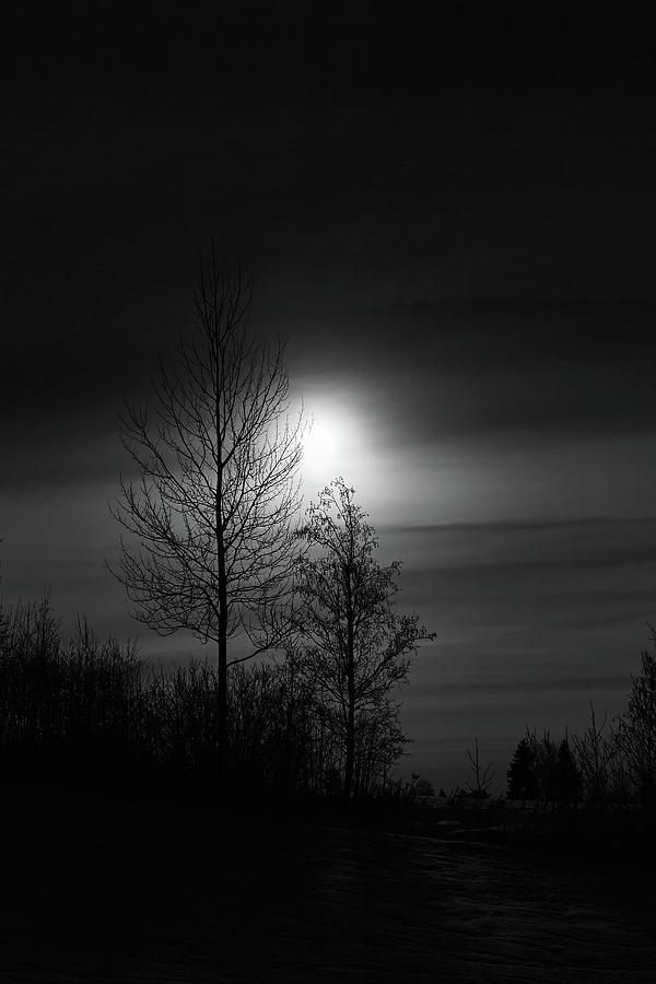 Behind the clouds. Full moon at Parkkuu January 2024. bw Photograph by ...