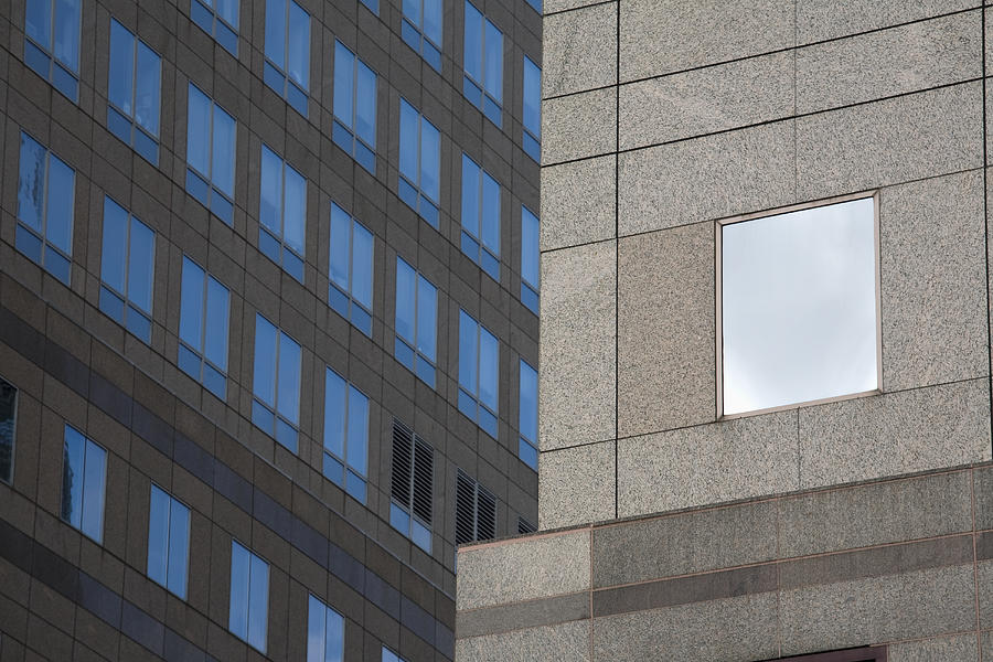 Beige granite skyscraper with glass windows Photograph by David Henderson
