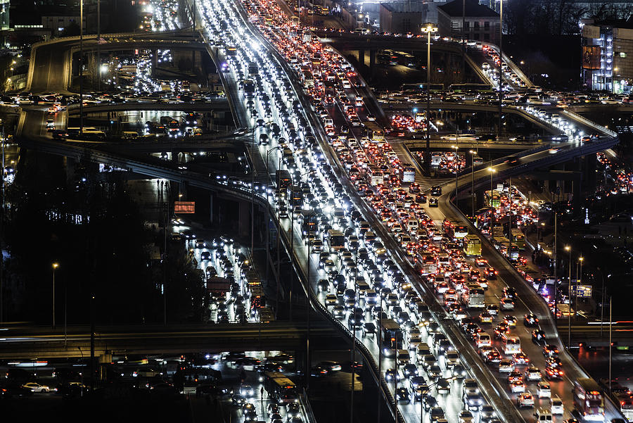 Beijing,road intersection,busy with traffiat night Photograph by Martin Puddy