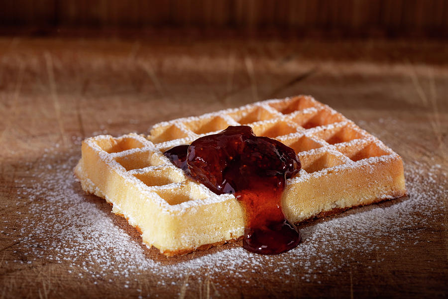 Belgian cake waffle with strawberry jam and poder sugar  Photograph by Sebastian Radu