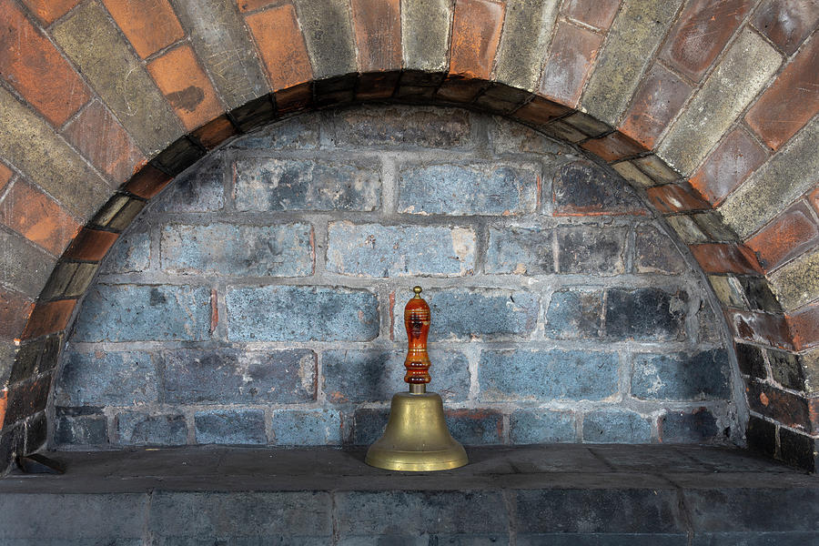 Bell in an engineering brick alcove Photograph by Steev Stamford