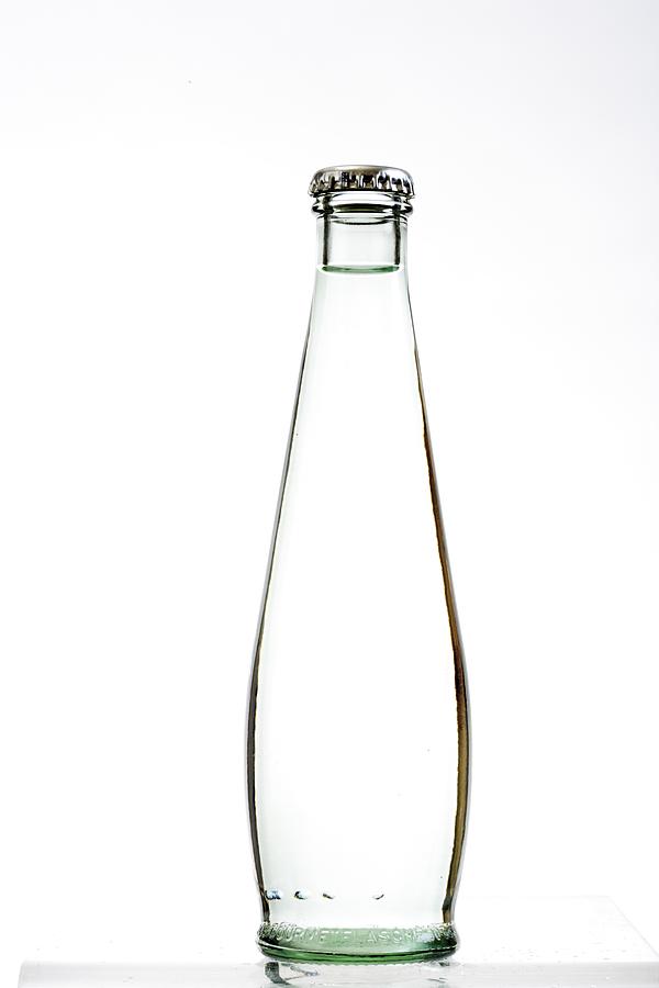 Bellied bottle of water, close-up Photograph by Creativ Studio Heinemann