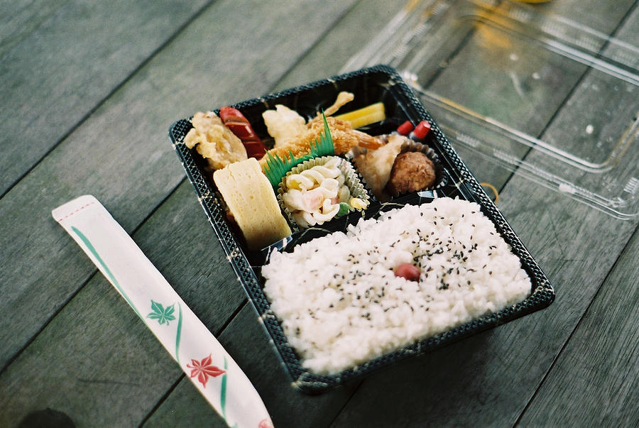 Bento box on old wooden table Photograph by Dapple Dapple