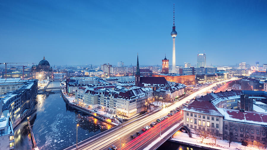 Berlin winter skyline with snow on the roofs Photograph by Spreephoto.de