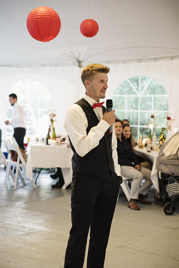 Best mans speech at the table of honour at wedding reception. Photograph by Martinedoucet