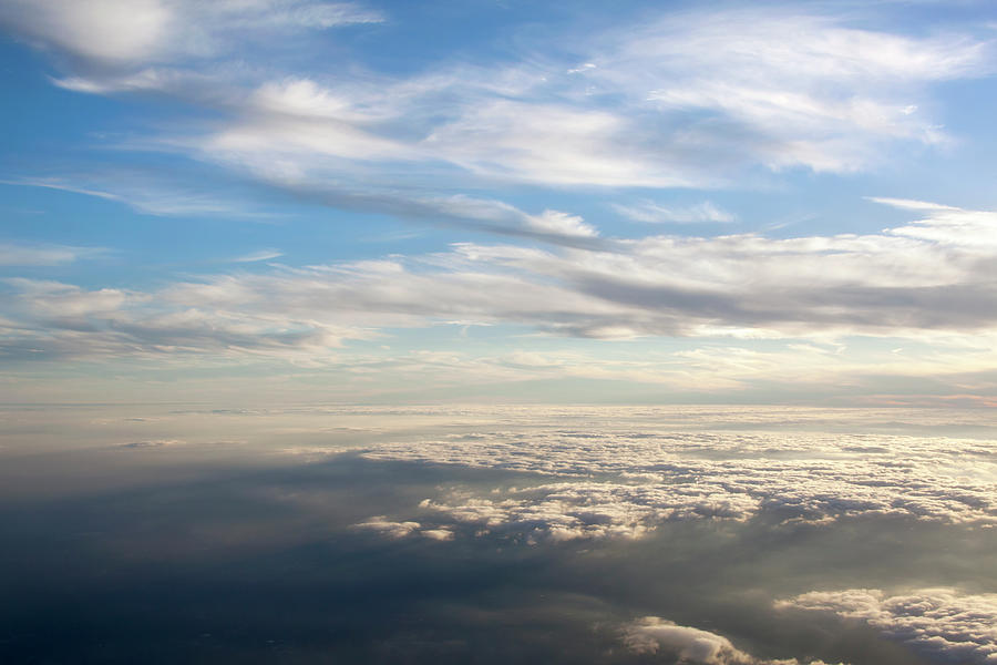 Between Clouds Photograph by Ramunas Bruzas