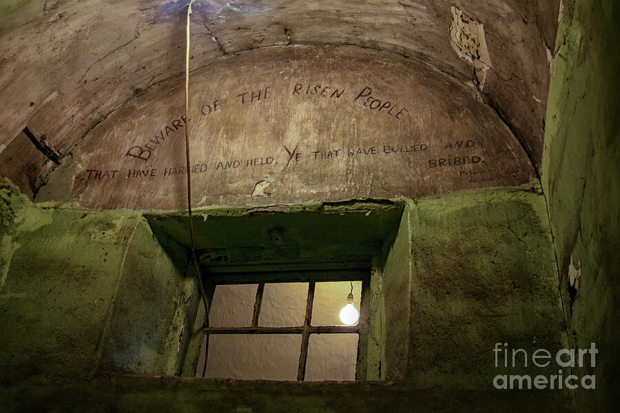 Interiors Photograph - Beware of the risen people .... Inscription on wall of Kilmainham by Patricia Hofmeester
